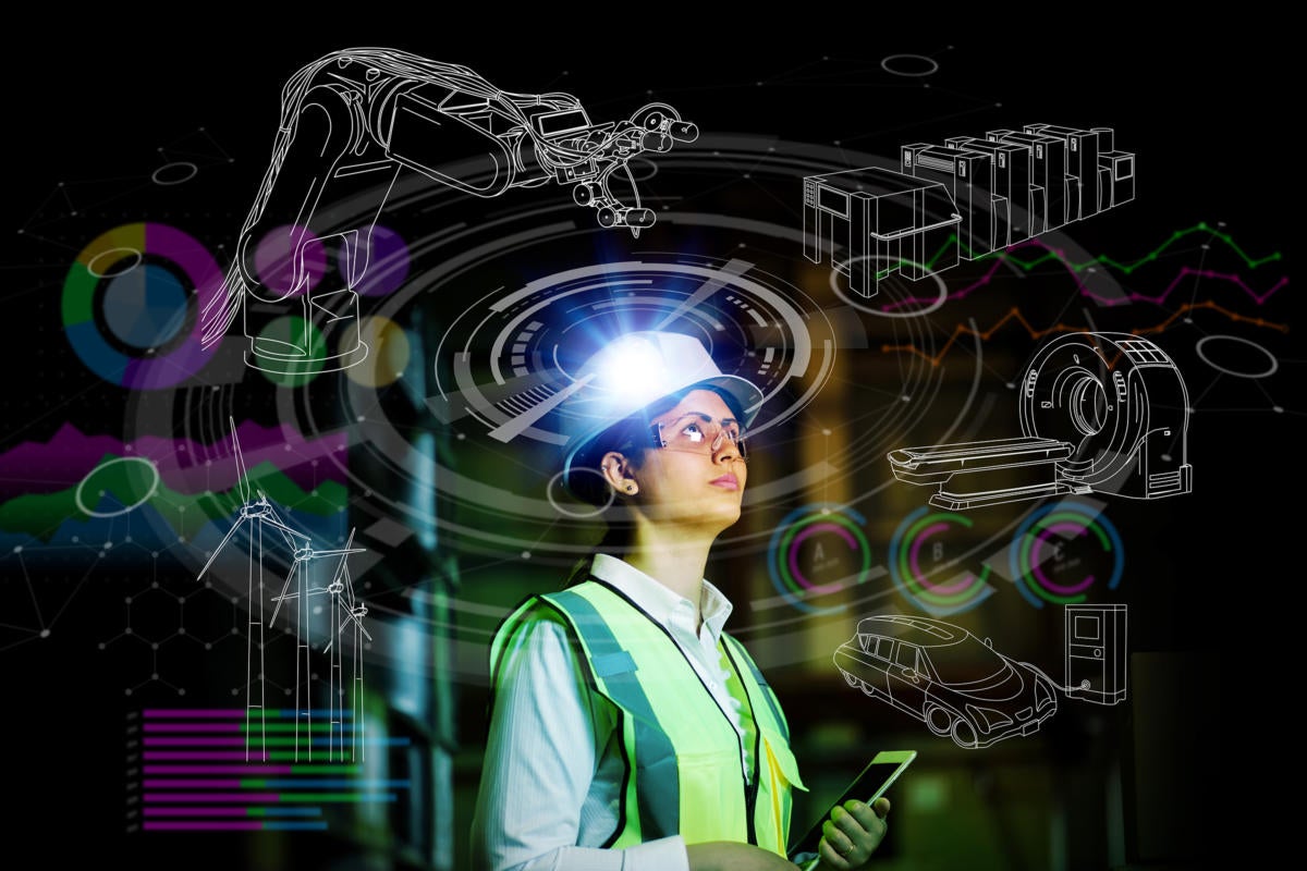 Industry 4.0 / Industrial IoT / Engineer reviews virtual interface for robotics.